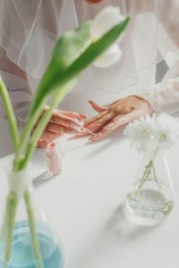 a woman is using polish nails