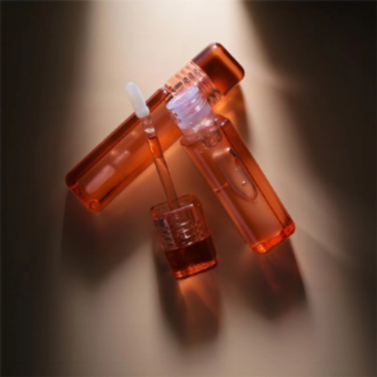 Packaging components to review with chosen lip gloss formula and applicator